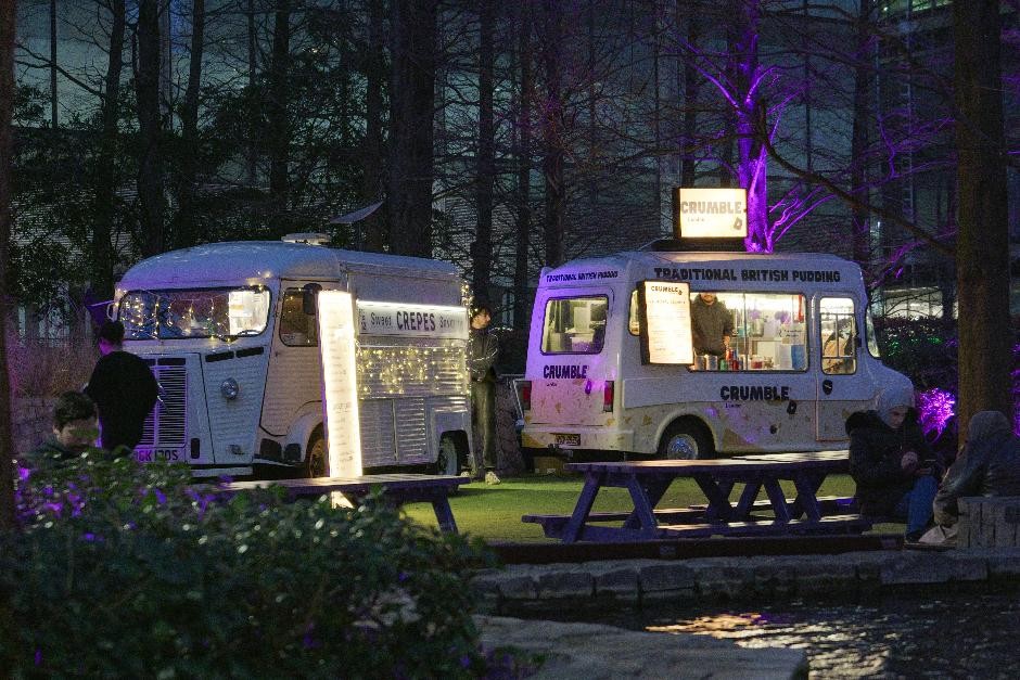 Two food trucks at winter lights in London