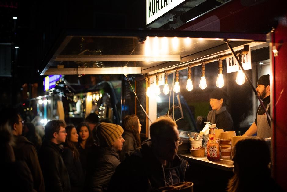 People waiting for food at a festival