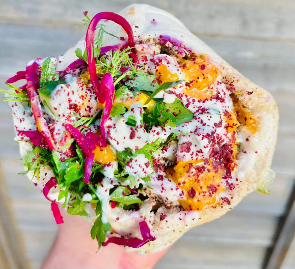 Delicious filled wrap held in a hand