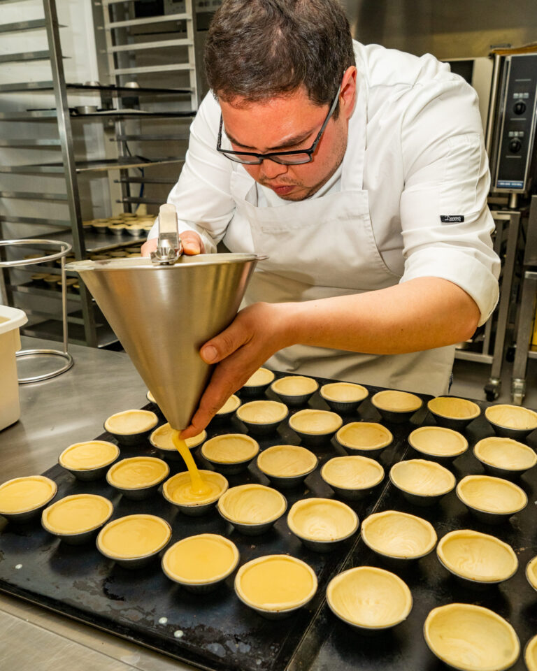 Chef making pastel de nata