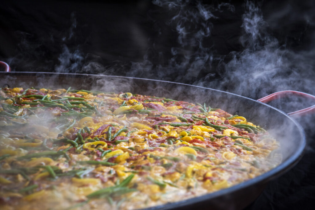 Large pan of paella being cooked