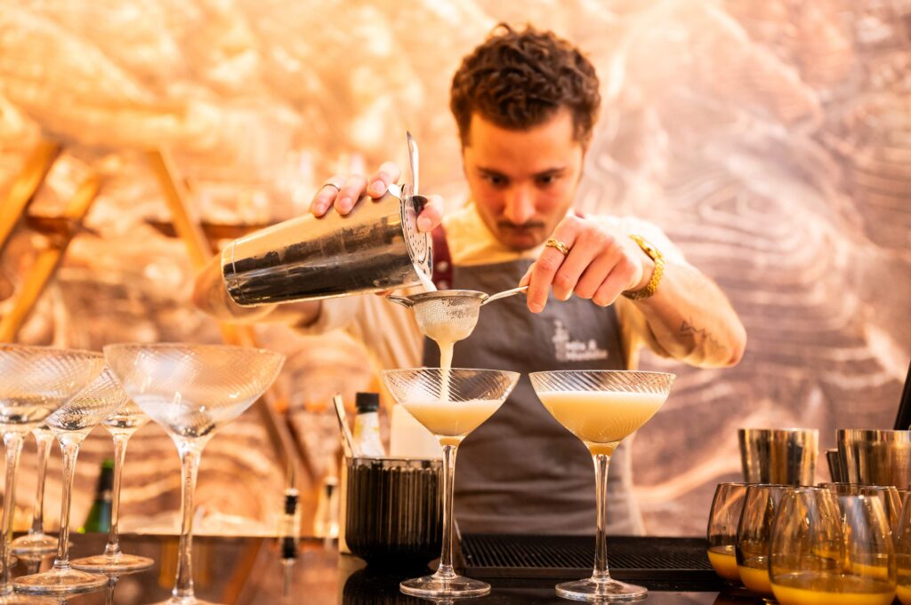 Bar tender finishing Christmas cocktails