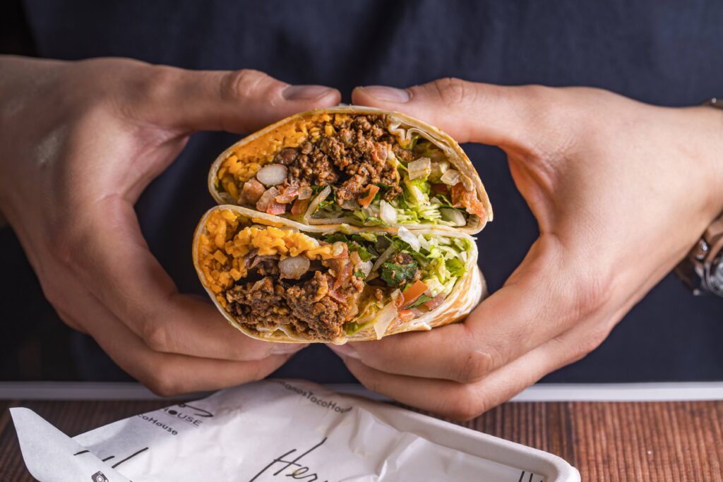 Image of a burrito held in two hands